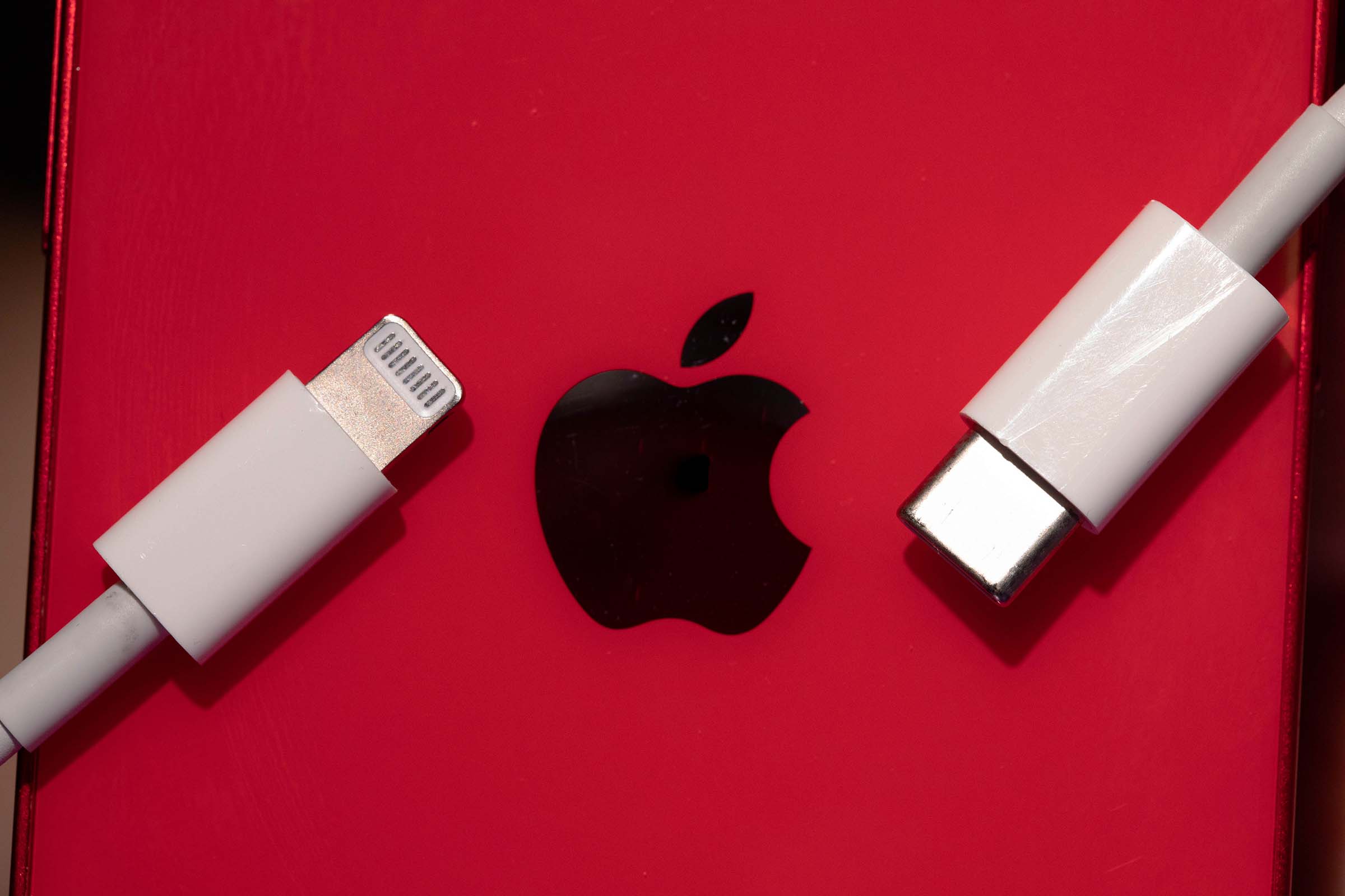 Photo illustration of an Apple lightning plug and a USB-c plug. (Monica Rodman/The Washington Post)